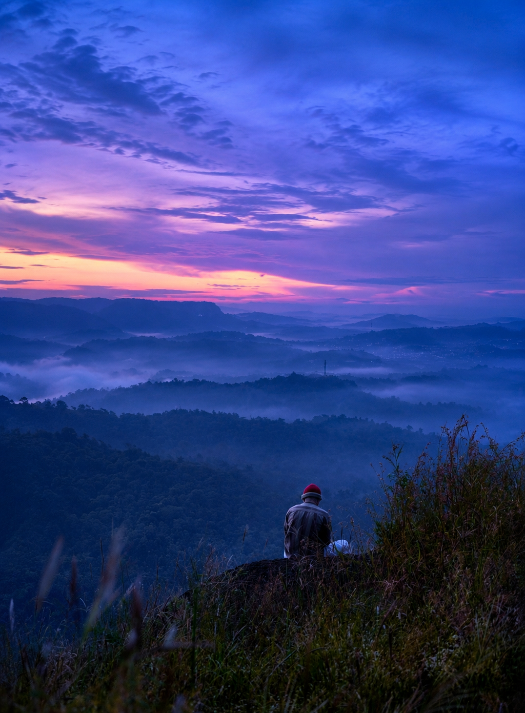 Dreamy misty mountain landscape with a rare twilight spectrum and cinematic atmospheric colors.