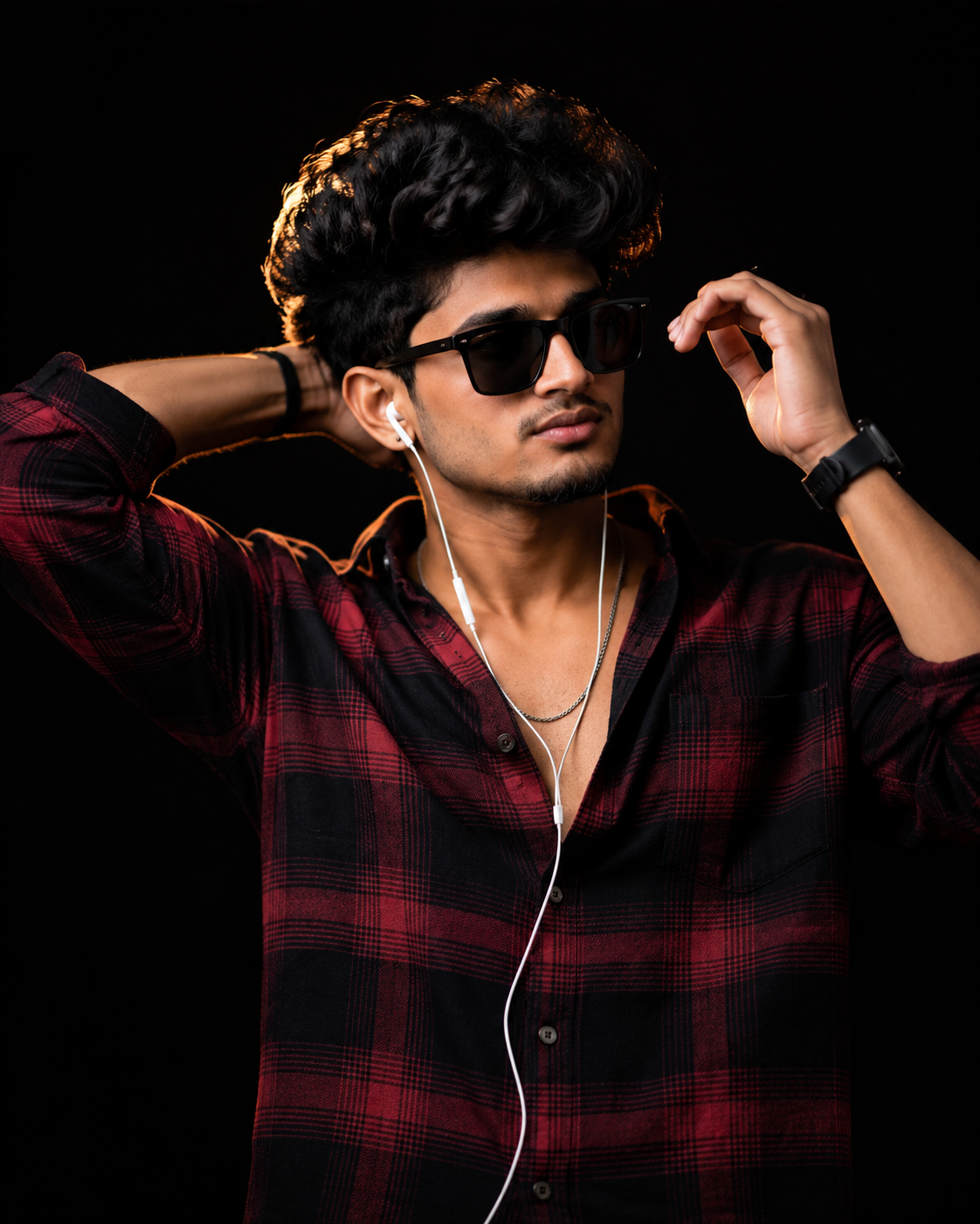 Ultra-realistic cinematic studio portrait of a stylish young man in a red and black plaid flannel shirt with sunglasses, dramatic moody lighting, and a premium black background